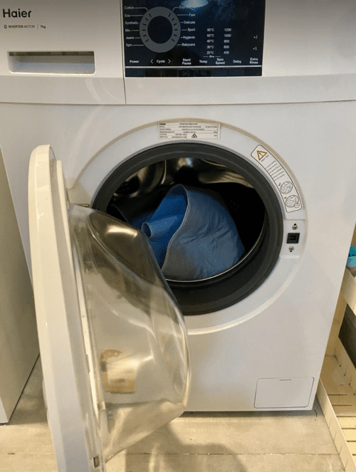 washing reusable puppy pee pads inside a washing machine 